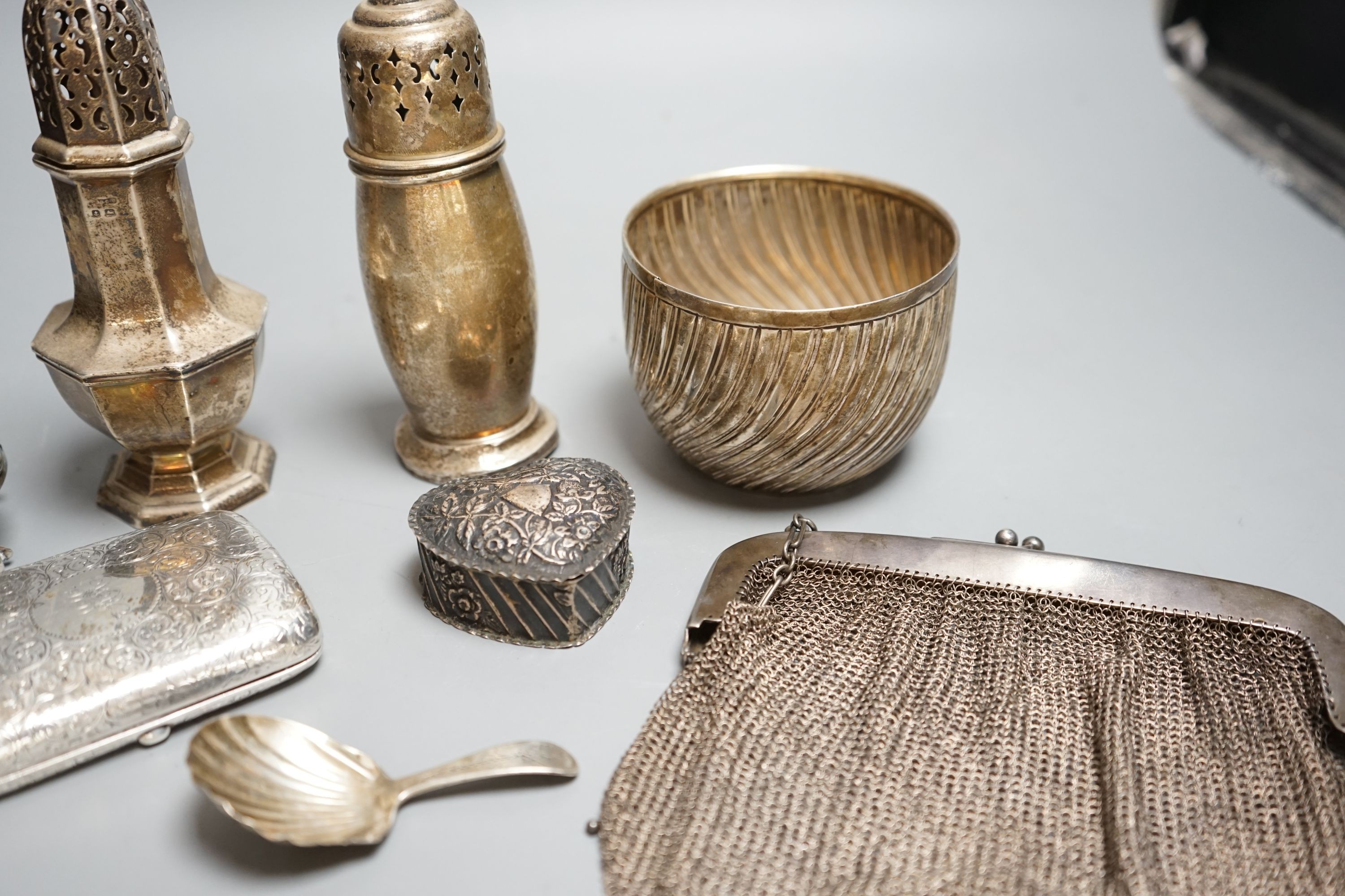 Small silver including a Victorian sugar bowl(split), two sugar casters, a pot pourri box(a.f.), cigarette case, caddy spoon etc.